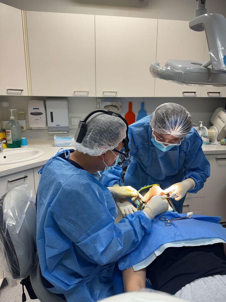 Dentists performing oral surgery at Doan Dental Care